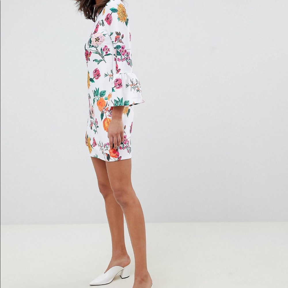 White 3/4 sleeve floral dress with fluted sleeves